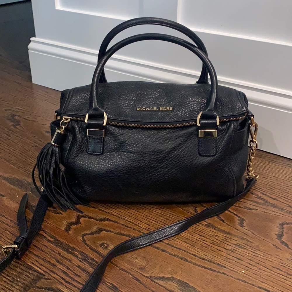 Authentic, gently used Michael Kors black leather bag with gold accents